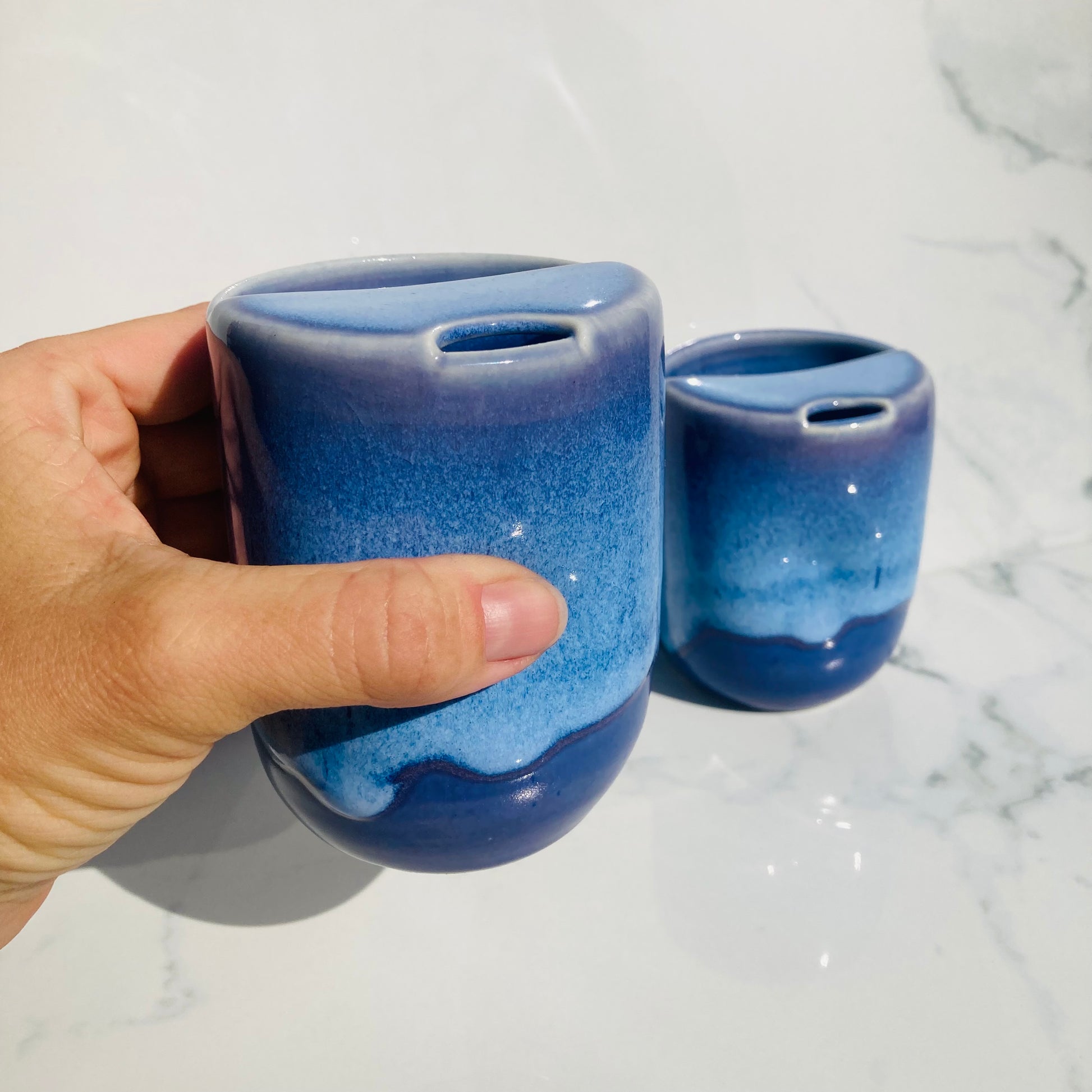 Non-toxic handmade ceramic travel mugs with dimpled grip and half sipping lid
