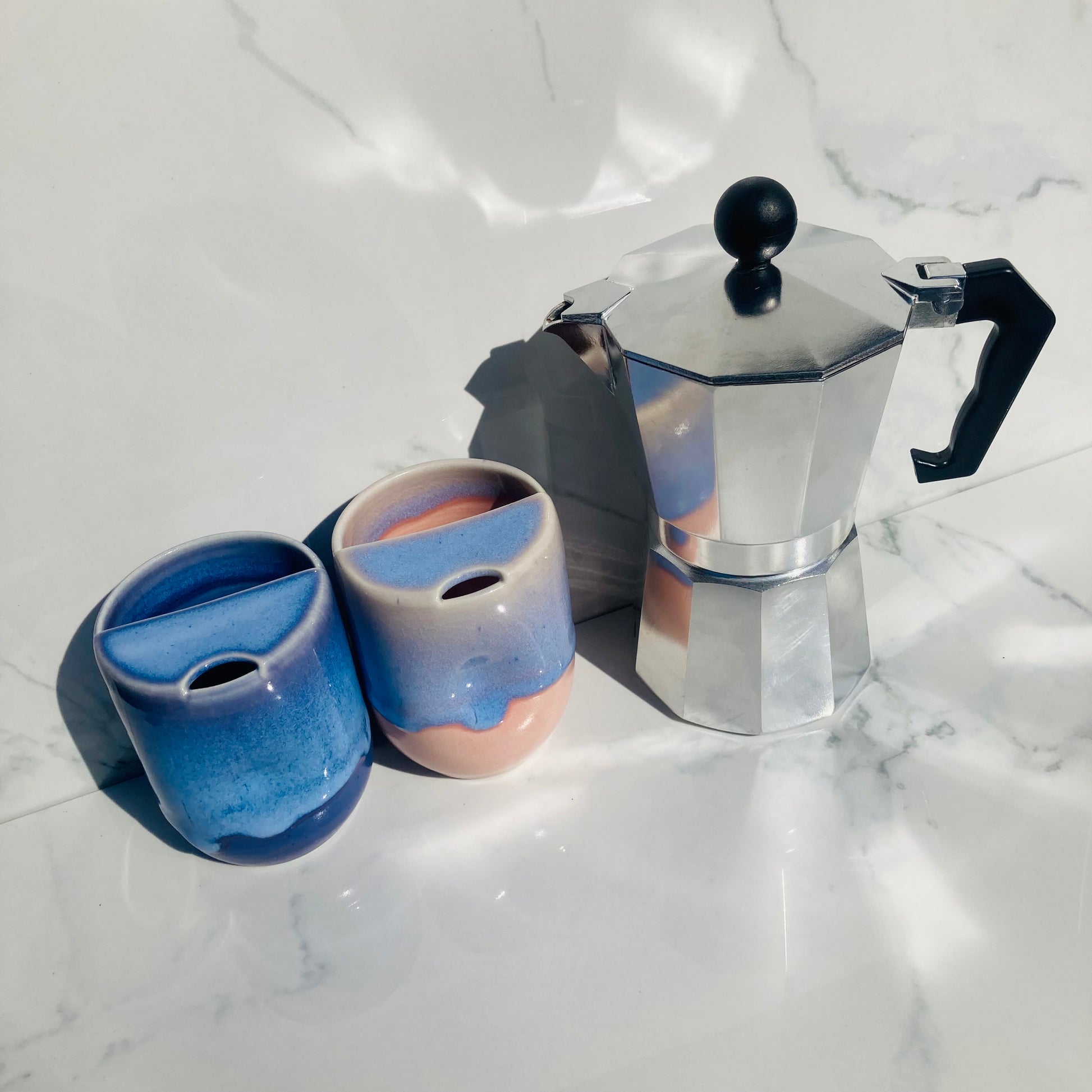 Set of two indigo ceramic travel mugs for coffee and tea lovers, zero-waste and woman-owned